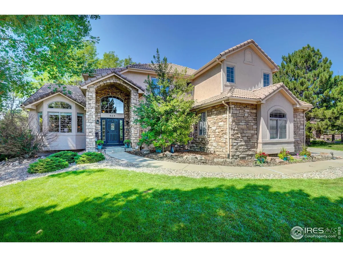 Up a tree-lined street atop a hill is a beautiful stone and stucco home you simp…