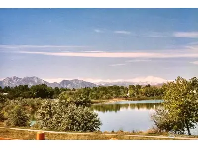 Backs to Ketner Reservoir with mountain views and a main level primary suite!  L…
