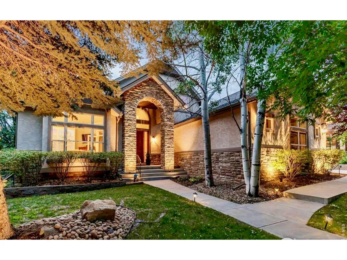 MAIN LEVEL PRIMARY SUITE! CUSTOM HOME ENCLAVE! Striking semi-custom home backing…